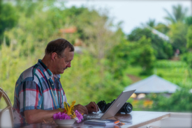 Roy working in another country on holiday