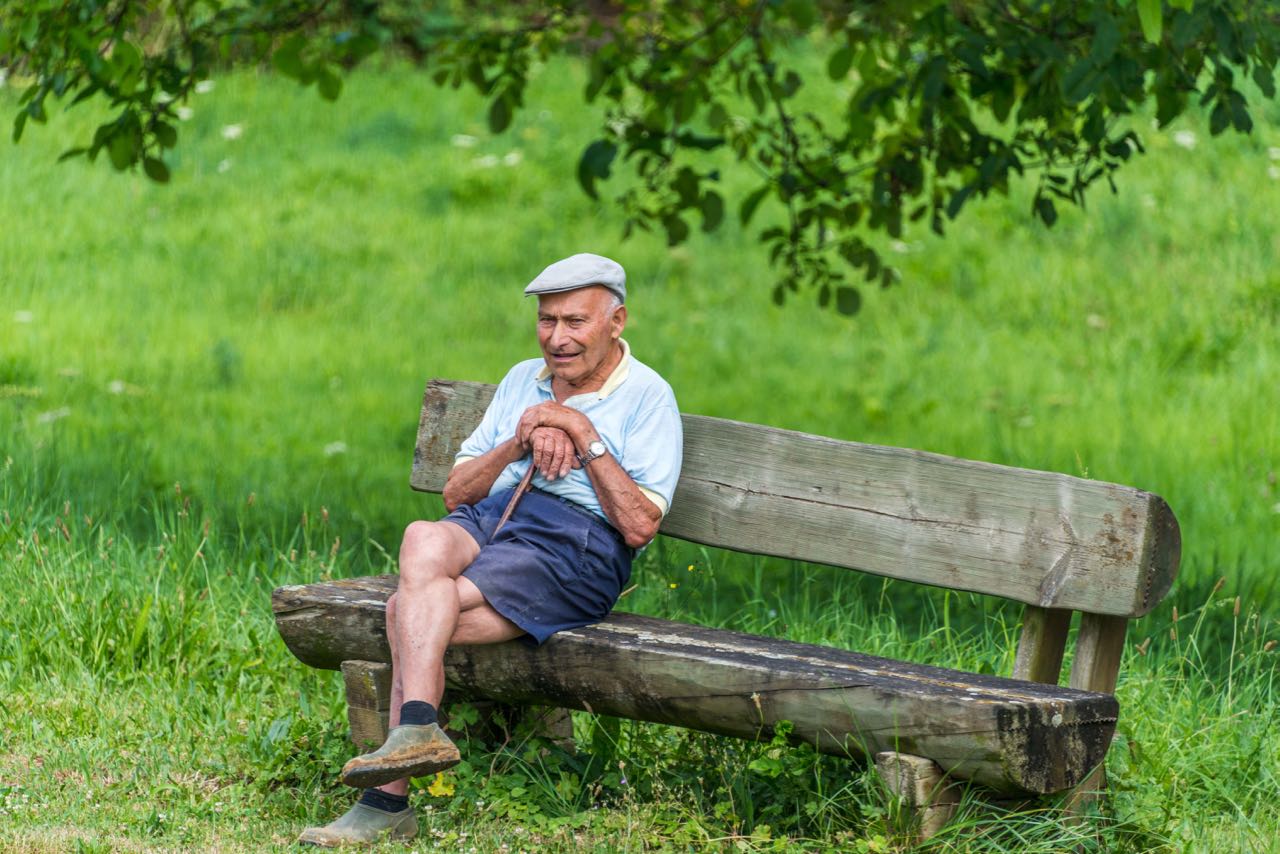 local Frenchman watches as barge cruises down the river