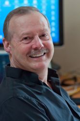 Roy Stevenson sitting in front of his computer.